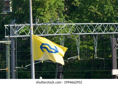 Arnhem, Netherlands - June 2, 2021: The Yellow Flag Of The Dutch Railways, Called The NS, Waving In The Wind