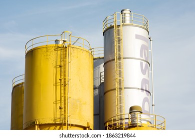 Arnhem, Netherlands - November 7, 2020: Large yellow and silver colored metal industrial silos by the Basel factory - Shutterstock ID 1863219844