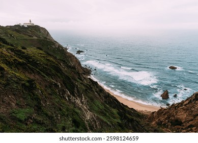 Aroeira Beach. Overlooking the dramatic cliffs and crashing waves of Cape Roca, Portugal, the westernmost point of continental Europe.