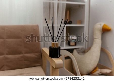 The aroma diffuser is located in the children's room. Concept: a pleasant smell in the playroom of a child or teenager.