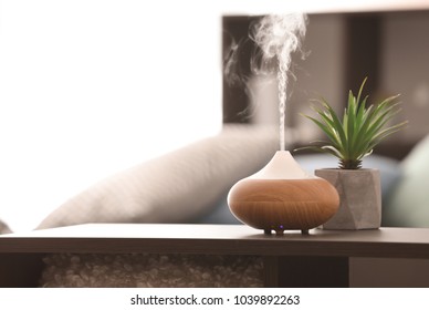 Aroma lamp on table - Shutterstock ID 1039892263