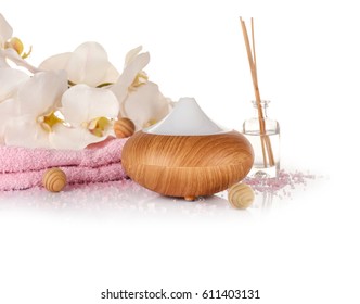Aroma oil diffuser and spa set on white background