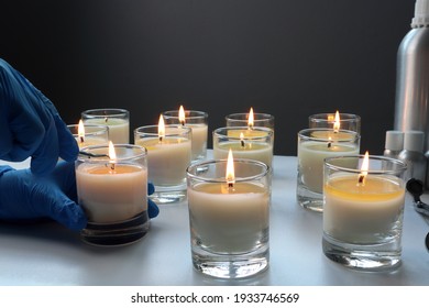 Aroma Scented Candle Glasses Are On The White Table With Fragrance Oil During The Burning Test Process In The Lab Checking For The Soot And Temperature Burning Time Before Selling In The Candle Market