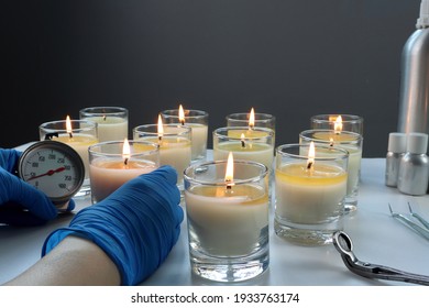 Aroma Scented Candle Glasses Are On The White Table With Fragrance Oil During The Burning Test Process In The Lab Checking For The Soot And Temperature Burning Time Before Selling In The Candle Market