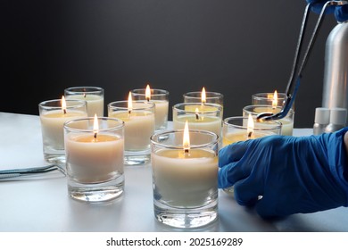 Aroma Scented Candle Glasses Are On The White Table With Fragrance Oil During The Burning Test Process In The Lab Checking For The Soot And Temperature Burning Time Before Selling In The Candle Market