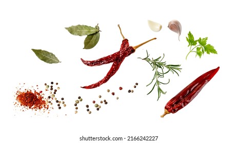 Aroma spice card: dried red hot chilli peppers, cloves garlic, mix peppercorn, bay leaves, rosemary and parsley fresh herb. Aromatic spicy ingredients for cuisine isolated on white background - Shutterstock ID 2166242227