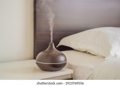 Aromatherapy Concept. Wooden Electric Ultrasonic Essential Oil Aroma Diffuser and Humidifier. Ultrasonic aroma diffuser for home
