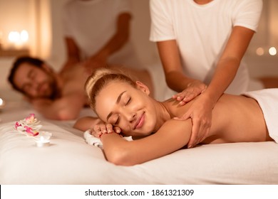 Aromatherapy And Massage. Happy Couple Relaxing Lying In Luxury Spa With Eyes Closed, Enjoying Body Care Treatment. Wellness, Relax And Beauty Treatment Concept. Selective Focus
