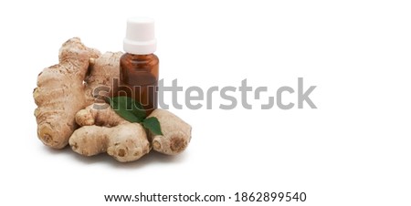 aromatherapy oil and ginger root, amber bottle. copy space [[stock_photo]] © 