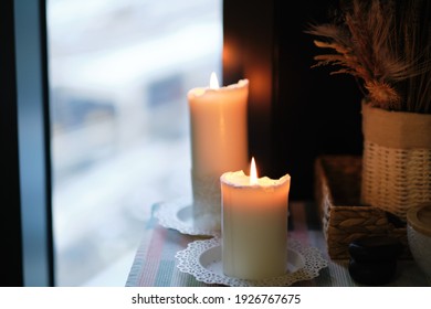 Aromatherapy votive candles burning with a soft glowing flame for a relaxation and pampering wellness treatment session in a spa