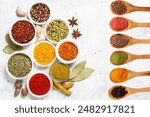 Aromatic Assortment of Spices and Herbs for Culinary Delights a variety of spices and herbs arranged on a dark, circular stone surface. Small bowls contain ingredients Various spices and herbs in bowl