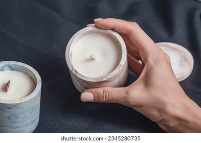 Aromatic decorative candles in plaster bowls. Handmade, making candles - Shutterstock ID 2345280735