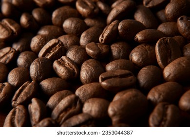 Aromatic Elegance: A close-up masterpiece capturing the intricate details of coffee beans on a rich wooden texture. The interplay of texture and aroma unfolds against a warm backdrop