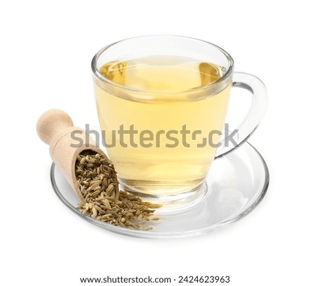 Aromatic fennel tea in cup, seeds and scoop isolated on white