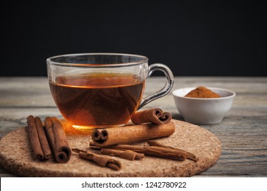 Aromatic Hot Cinnamon Tea On Wooden Table