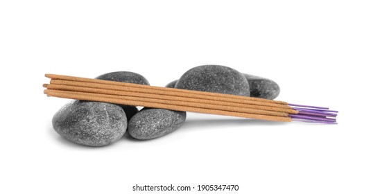 Aromatic Incense Sticks And Spa Stones On White Background