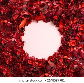 Aromatic mix of potpourri of dried flowers. A bunch of dry potpourri flowers with paper card for copy space. Romantic Valentines day composition. Flat lay. Love or SPA concept.