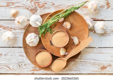 Aromatic powdered garlic on table - Shutterstock ID 2023665365
