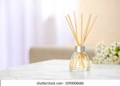 Aromatic reed freshener on table in room