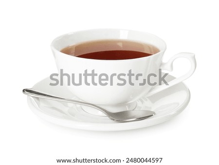 Aromatic tea in cup and spoon isolated on white