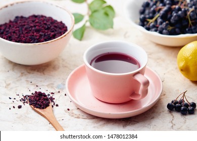 Aronia Berry Tea  In A Cup. Dried Aronia Berries Are Commonly Used To Make Antioxidant-rich Herbal Tea.