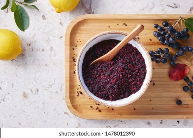 Aronia Tea In A Bowl. Dried Aronia Berries Are Commonly Used To Make Antioxidant-rich Herbal Tea.