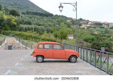 Arqua Petrarca, ITALY - SEPTEMBER 4, 2014: Renault 4 Quatrelle 4L Classic Vintage French Car On The Old City Street. The First Front-wheel Drive Family Car Produced By Renault From 1961.