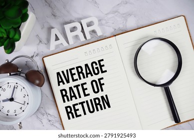ARR - Average Rate of Return acronym on notepad, Business concept background