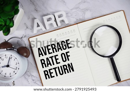 ARR - Average Rate of Return acronym on notepad, Business concept background
