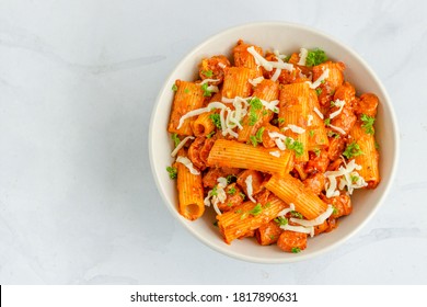 Arrabbiata Pasta With Sausage In A Bowl On White Background Top Down Horizontal  Photo