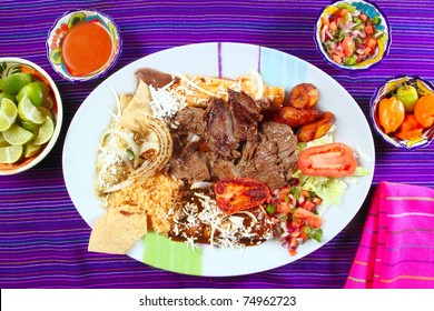 Arrachera beef flank steak Mexican dish assorted chili sauces Mexico spiced