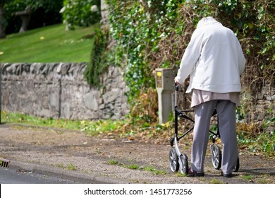 Arran, North Ayrshire / Scotland - 10th July 2019: Senior Elderly Vulnerable Person With Walking Zimmer Frame For Mobility In Remote Countryside