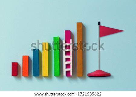 Arrange rising bar graph with stair and red flag. Concept of analysing information / Business concept growth success process: depicts the increment in annual financial budget or revenues of long term 