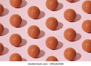 Arranged basketball on a pink background. Minimal design. Pattern.