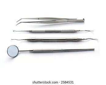 Arranged Dental Instruments on white background, metal, iron, steel, mirror