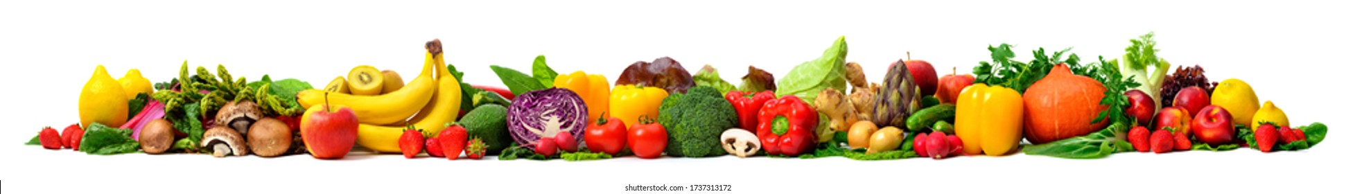 Arrangement of fruits and vegetables in many appetizing colors in a row, concept for a healthy plant-based lifestyle and fitness, super wide format ideal as a border, frame or banner
