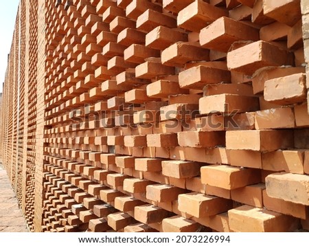 the arrangement of patterned bricks into an architectural element on the walls of the building