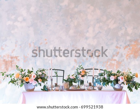 arrangement, wedding, design concept. gorgeous table setting for two person decorated with great bouquets of flowers and candles in different holders. with negative space for text