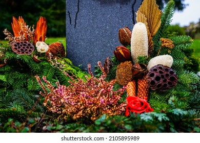 Arrangements Designed In Autumn Colors On A Grave Site.