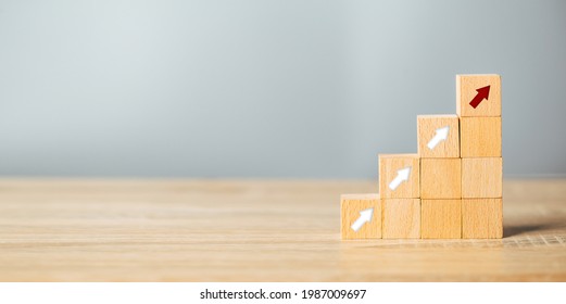 Arranging Wood Block Stacking As Step Stair With Arrow Up.Ladder Career Path For Business Growth Success Process Concept.