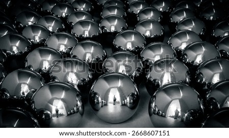 Array of chrome spheres with mirror reflections forming a clean geometric pattern