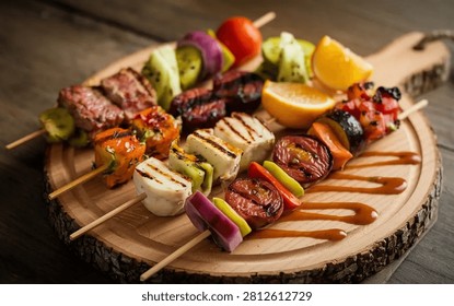 An array of colorful grilled mixed skewers, featuring meat, cheese, and various fruits and vegetables, is artfully arranged on a rustic wooden board with a bark edge, presented under warm light.