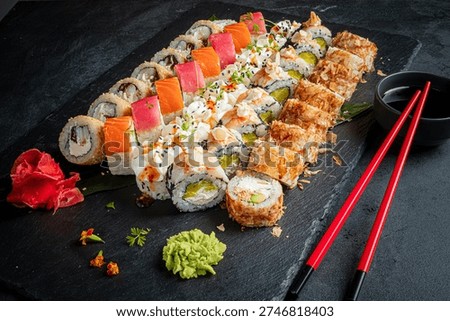 An array of colorful sushi rolls with diverse ingredients, beautifully presented.