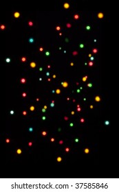 An Array Of Different Size Out Of Focus Fairy Lights Against A Black Background, Great As A Xmas Backdrop.