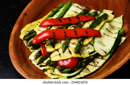 Array Of Grilled Vegetables Including Asparagus, Zucchini, Bell Pepper & Yellow Squash On Wood Serving Platter