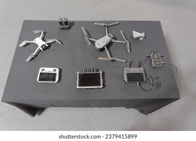 Array of metal components on a white table.