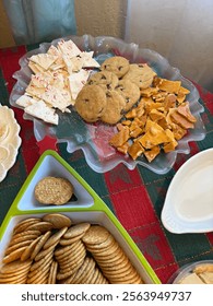 An array of peanut brittle, cookies and peppermint bark.  