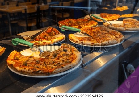An array of pizzas on a pizza buffet