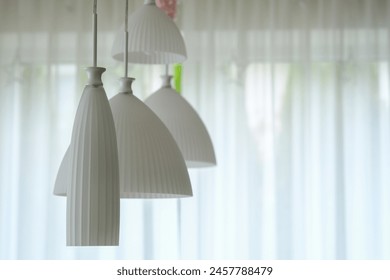 Array of White Hanging Lights in Ceiling