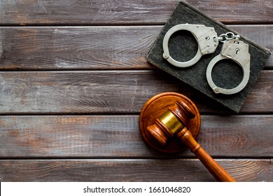 Arrest Concept. Handcuffs Near Judge Gavel On Dark Wooden Background Top-down Copy Space